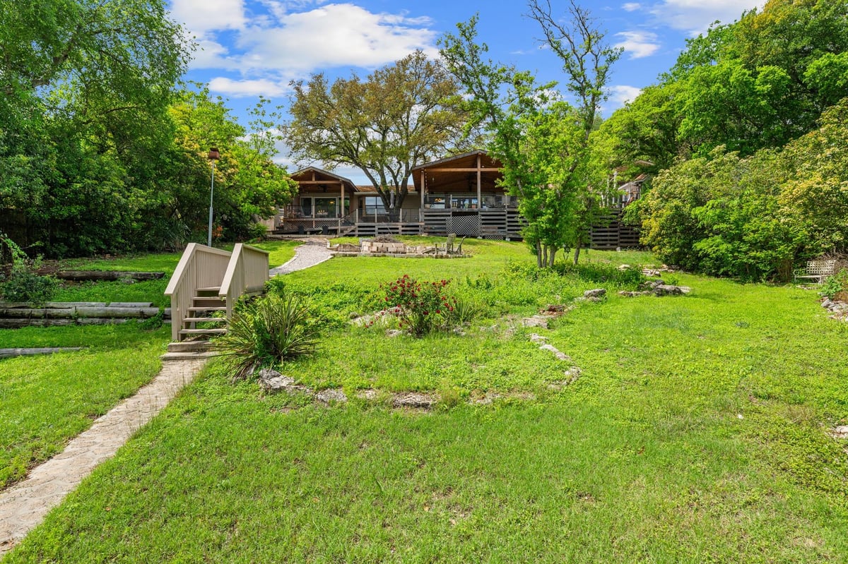 View 18000 Easy St in Gregg Point 18000 Easy St - front exterior - Luxury home in Gregg Point, Jonestown, TX