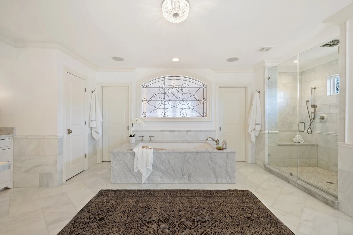 1810 W 35th Street - primary bath soaking tub under leaded glass, view 2