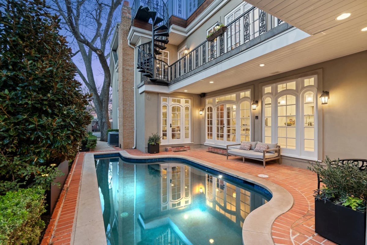 1810 W 35th Street - courtyard pool and brick decking at twilight, view 6