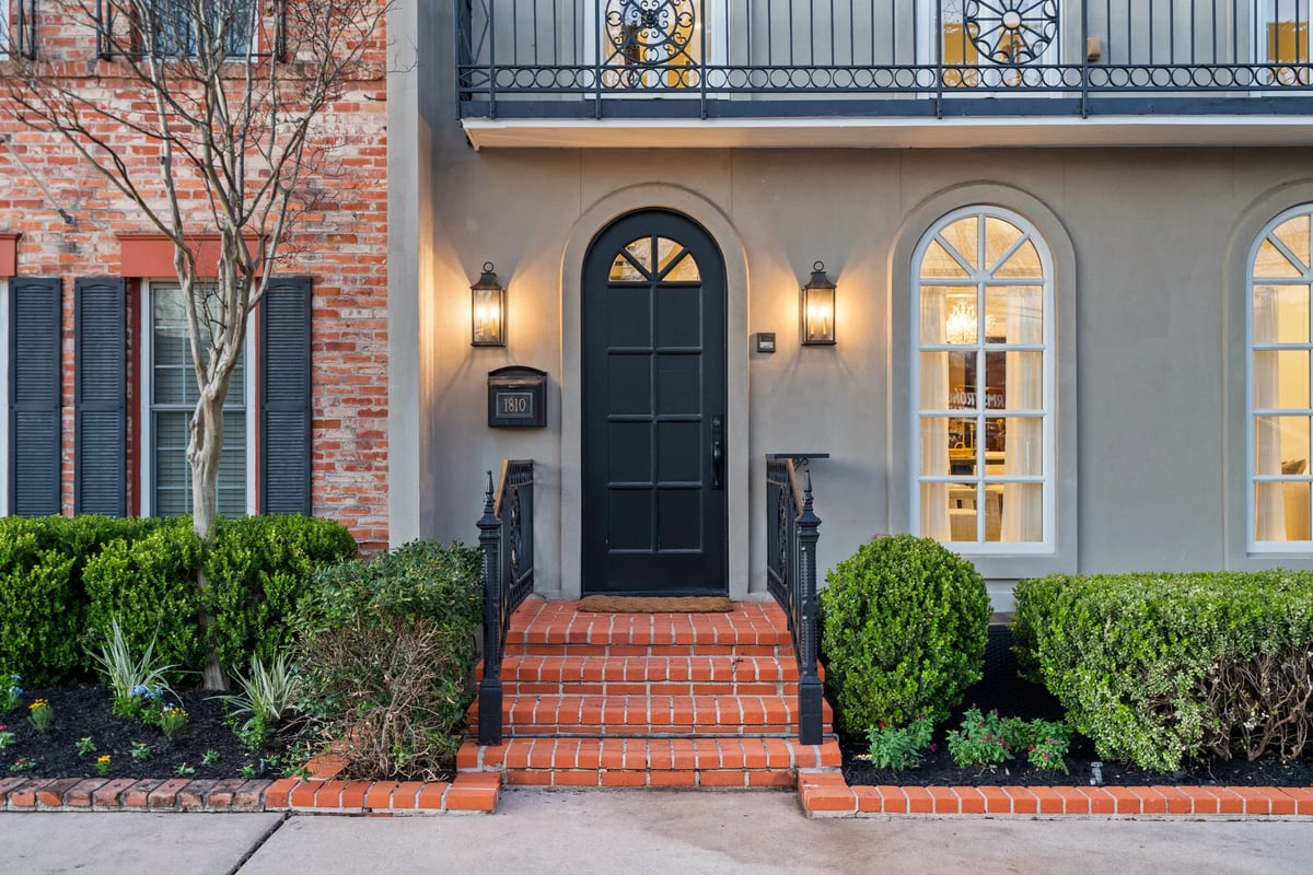 1810 W 35th Street - arched front door and brick steps, view 1
