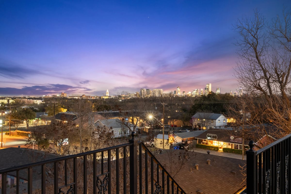 1810 W 35th Street - downtown skyline from the roof deck at twilight, view 2