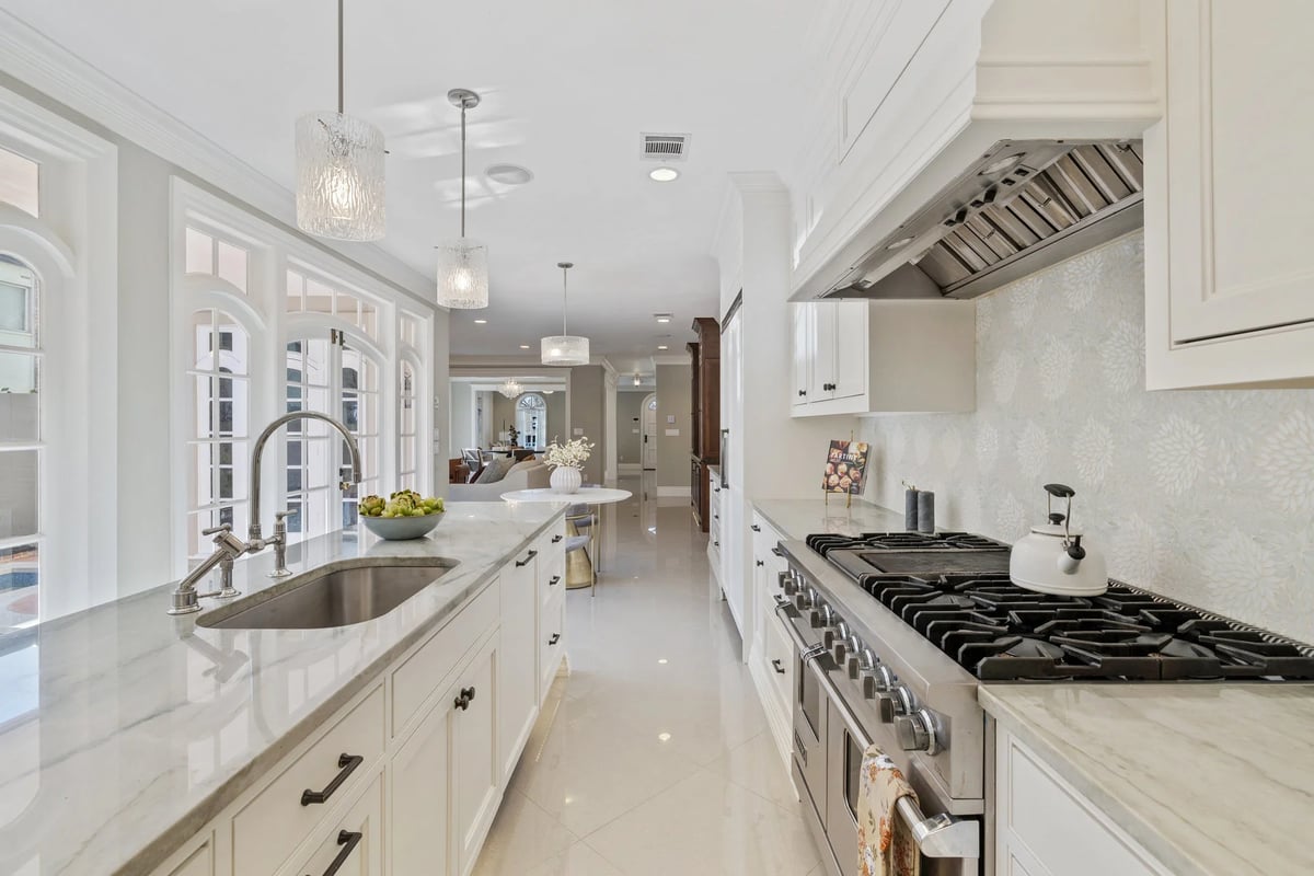 1810 W 35th Street - kitchen with Viking range and glass mosaic backsplash, view 15