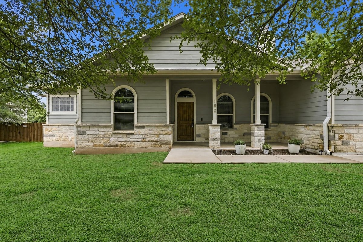 View 182 Waipahoehoe DR in Tahitian Village 182 Waipahoehoe DR - front exterior - Luxury home in Tahitian Village, Bastrop, TX