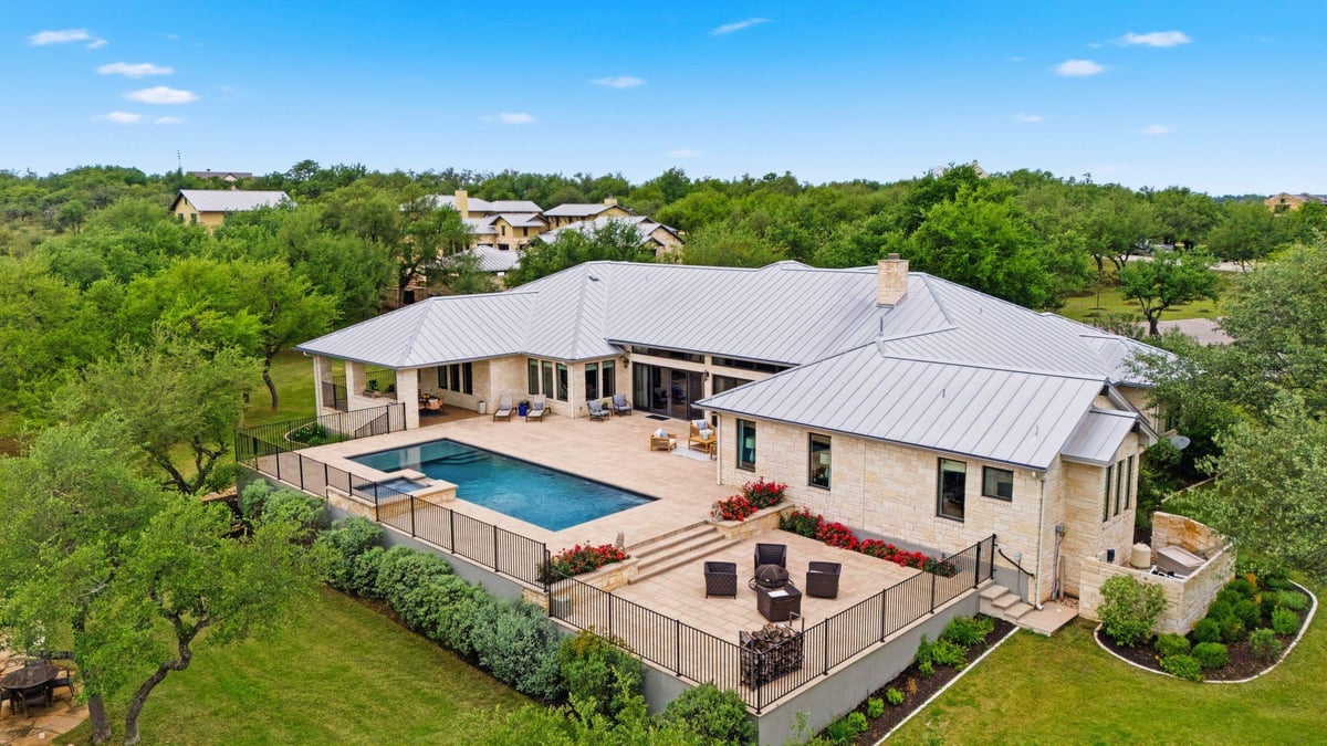 View 18601 Madrone Vista Dr in Madrone Ranch 18601 Madrone Vista Dr - aerial view with aerial estate view and pool terrace - Luxury home in Madrone Ranch, Austin, TX