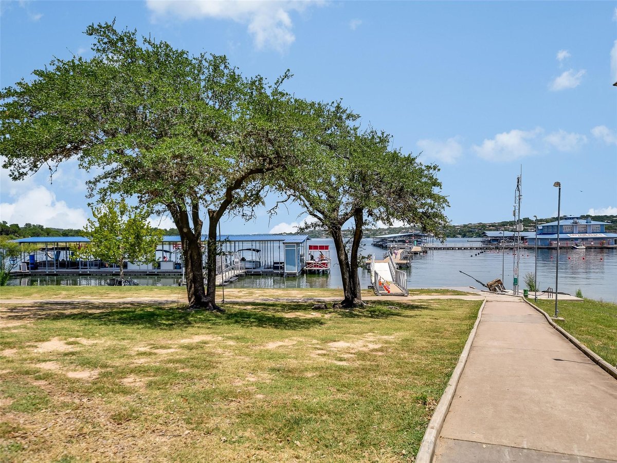 View 18803 Hogan CIR Unit #16 in Point Venture 18803 Hogan CIR Unit #16 - property photo 1 - Luxury home in Point Venture, Lago Vista, TX