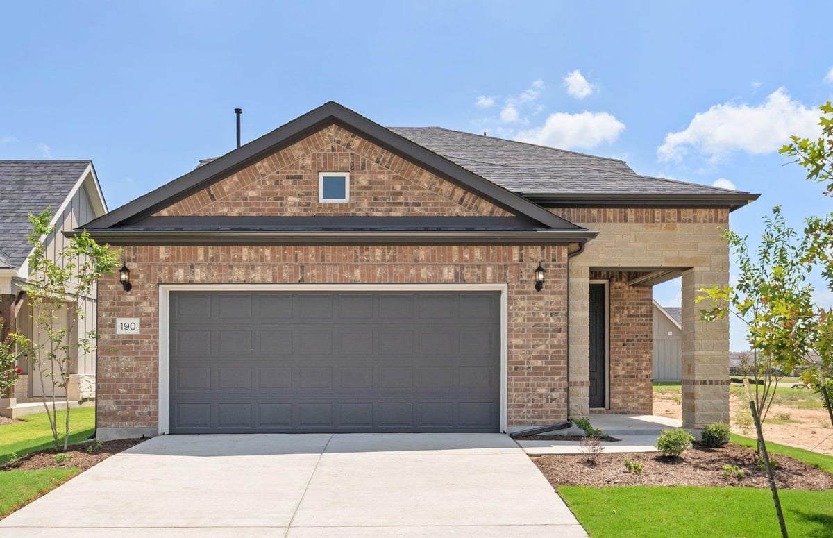 View 190 Frontera DR in Del Webb Lost Pines at The Colony 190 Frontera DR - property photo 1 - Luxury home in Del Webb Lost Pines at The Colony, Bastrop, TX