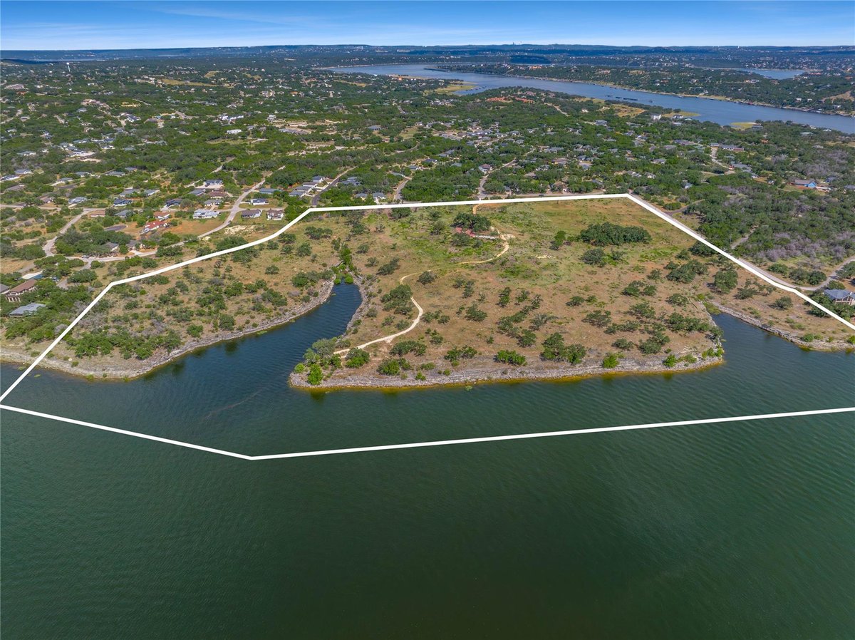 Aerial view with waterfront acreage with meander access at 1902 Patriot Dr - Emerald Pointe, Lago Vista, TX