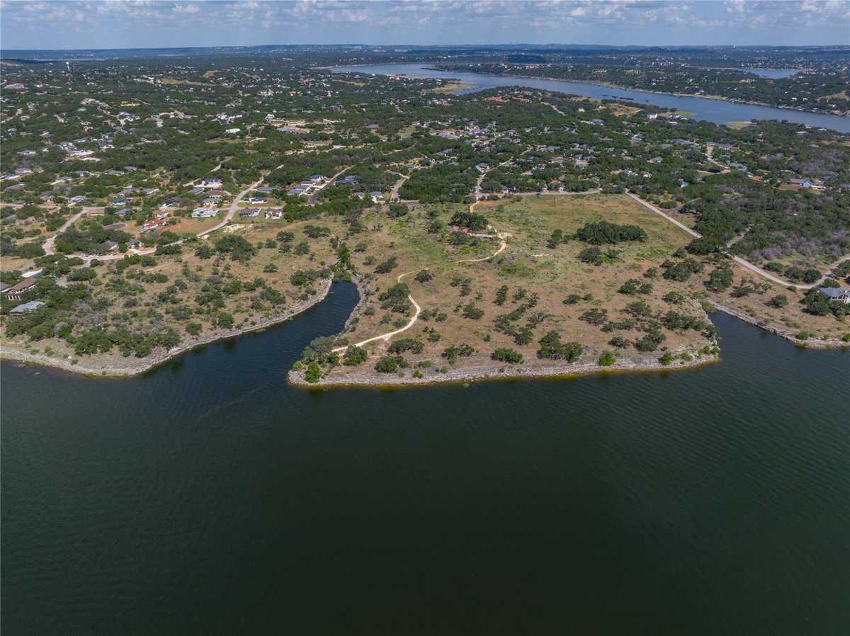 Aerial view with Lake Travis waterfront at 1902 Patriot Dr - Emerald Pointe, Lago Vista, TX