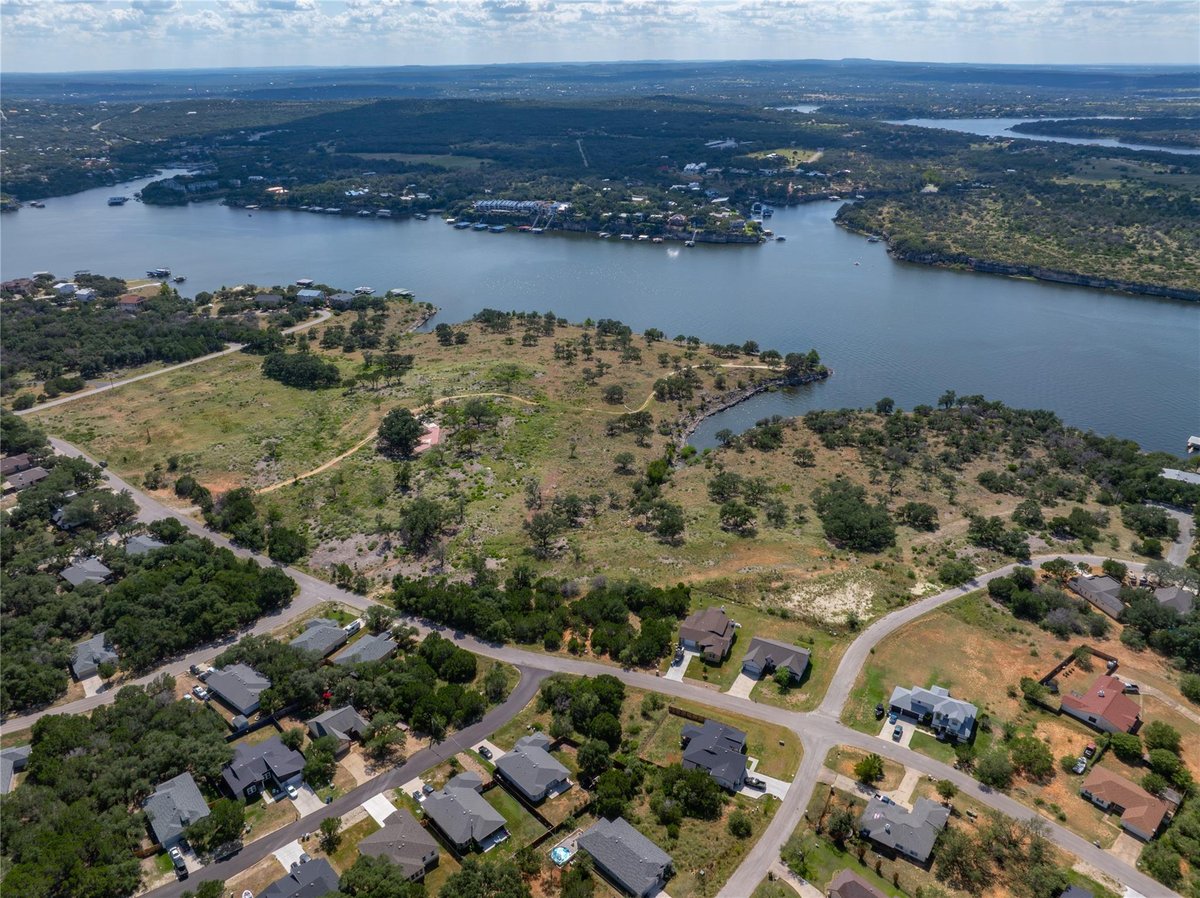 Aerial view with Lake Travis waterfront views at 1902 Patriot Dr - Emerald Pointe, Lago Vista, TX
