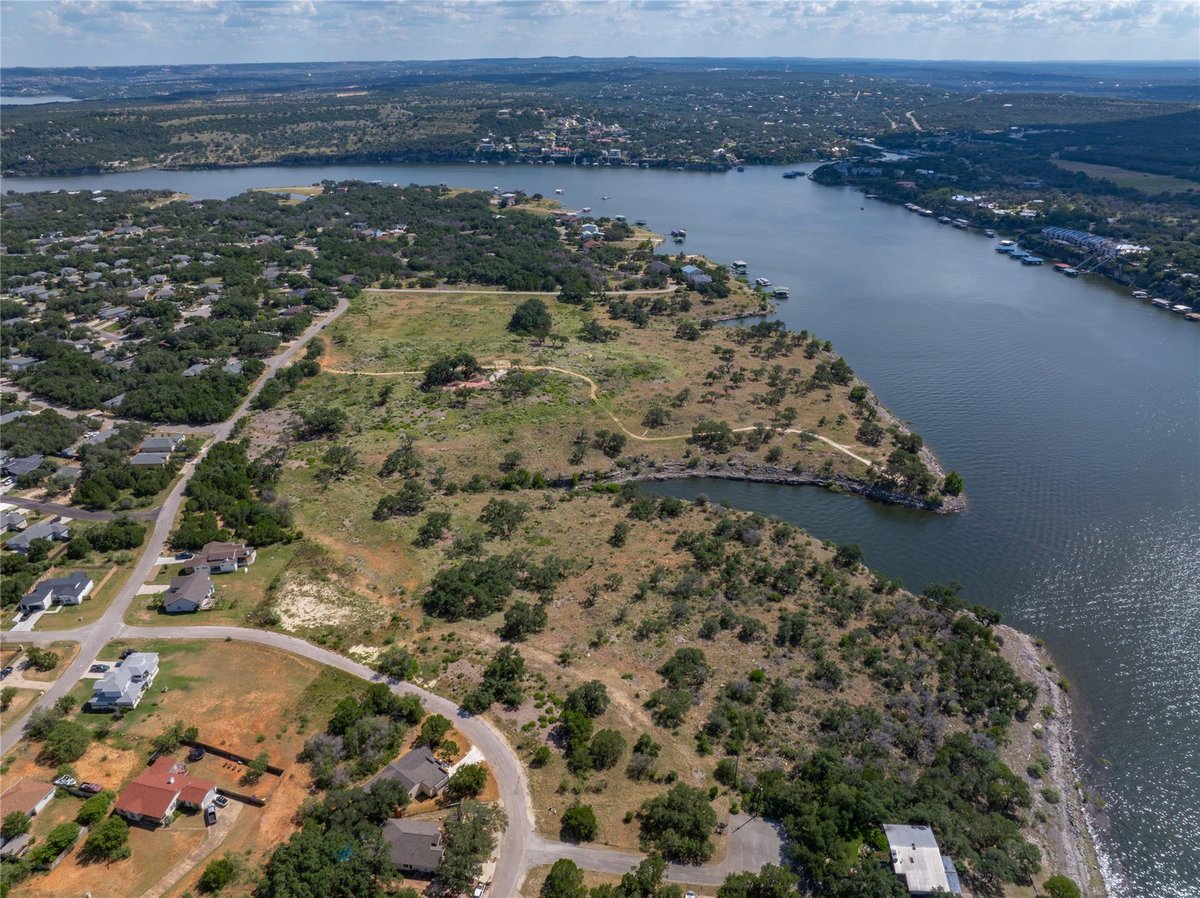 Aerial view with expansive lakefront property at 1902 Patriot Dr - Emerald Pointe, Lago Vista, TX