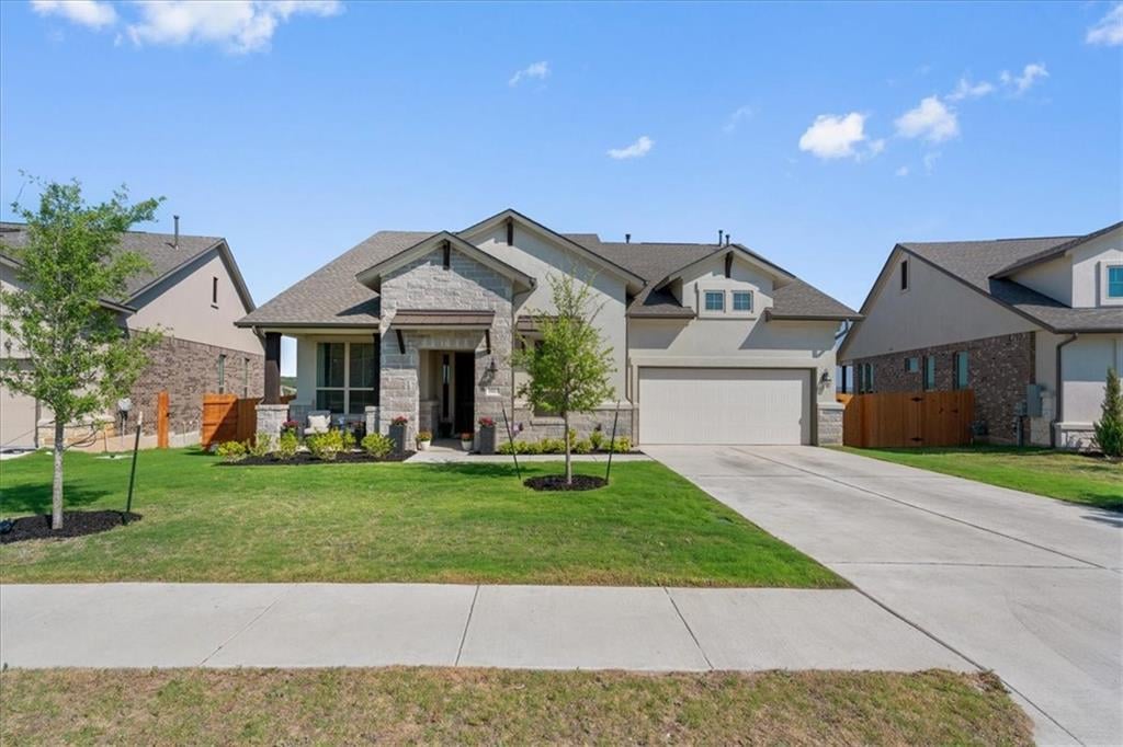 View 19113 Freeman Cir in Sweetwater Ranch Vlg N Sec 2 19113 Freeman Cir - front exterior - Luxury home in Sweetwater Ranch Vlg N Sec 2, Austin, TX