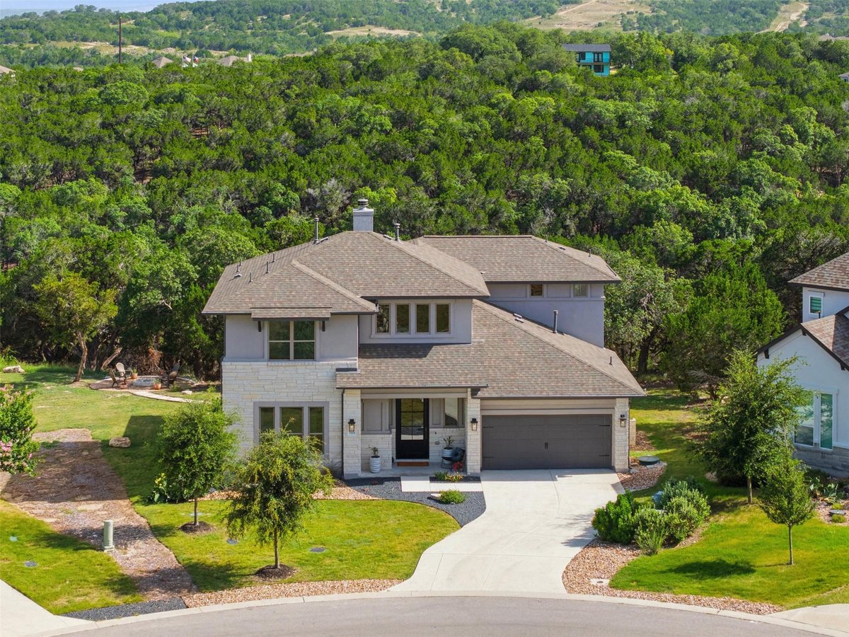 View 19408 Serenity LN in The Hollows 19408 Serenity LN - front exterior - Luxury home in The Hollows, Lago Vista, TX