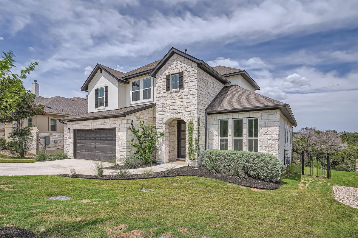 View 19444 Serenity Ln in Hollows Canyons Sec 1 19444 Serenity Ln - front exterior - Luxury home in Hollows Canyons Sec 1, Lago Vista, TX