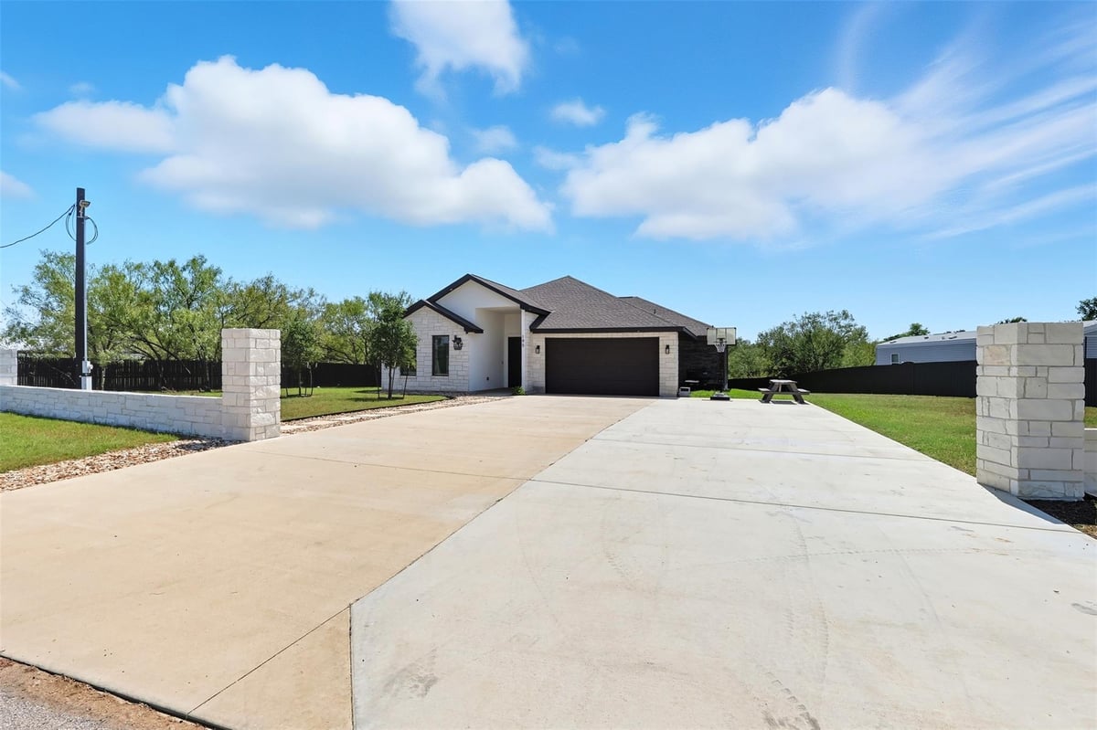 View 195 Blushing Dr in Arroyo Vista 195 Blushing Dr - front exterior - Luxury home in Arroyo Vista, Cedar Creek, TX