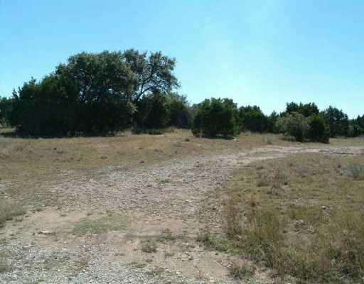 View 19615 Single Peak CV 19615 Single Peak CV - front exterior - Luxury lot in Spicewood, TX