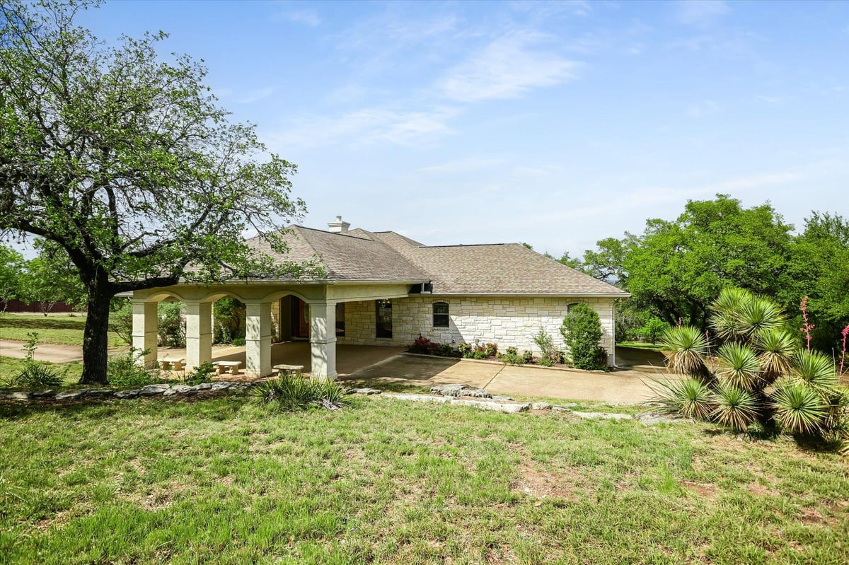 View 19620 Single Peak Cv in Travis Settlement Sec 02 19620 Single Peak Cv - front exterior - Luxury home in Travis Settlement Sec 02, Spicewood, TX