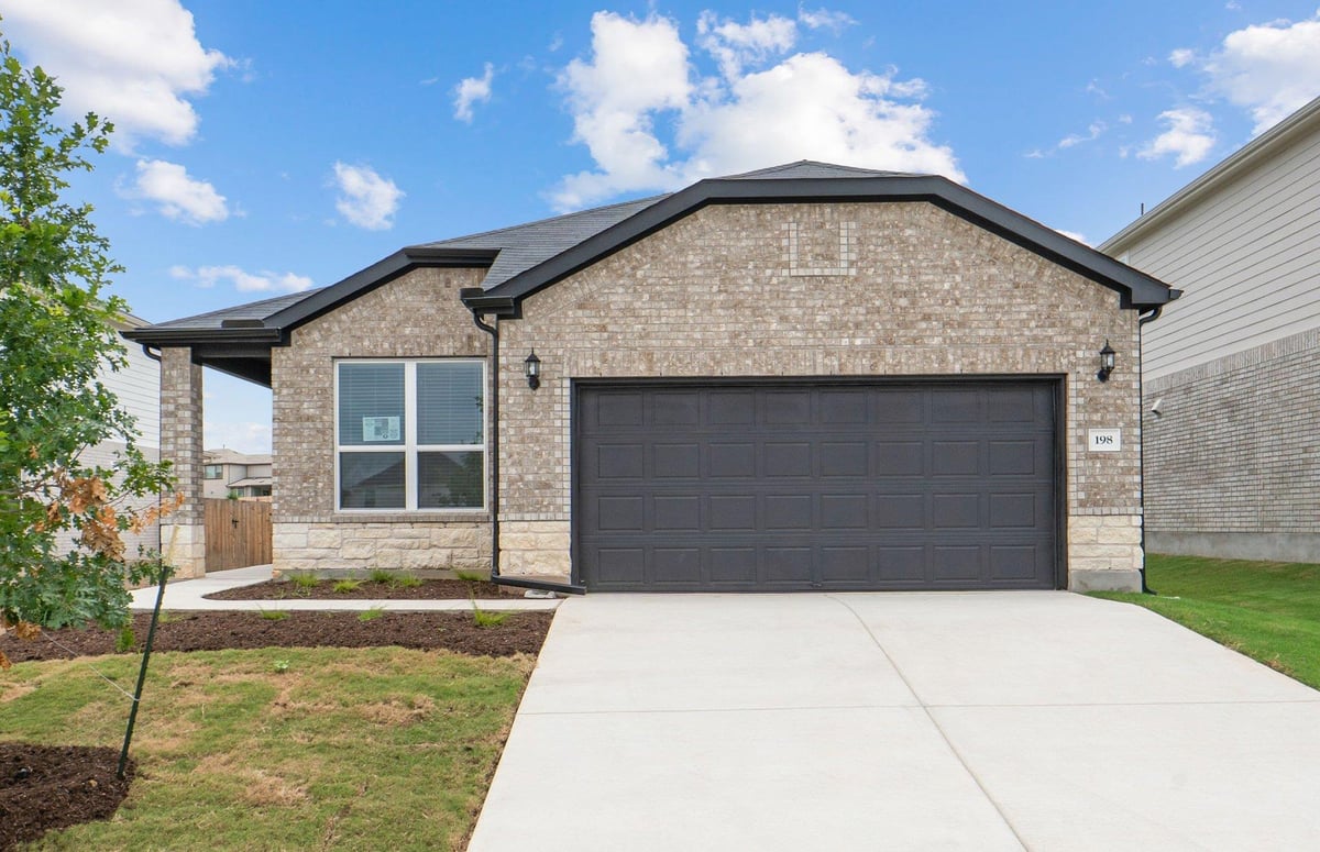 View 198 Rubber Tree WAY in Sunfield 198 Rubber Tree WAY - front exterior - Luxury home in Sunfield, Buda, TX