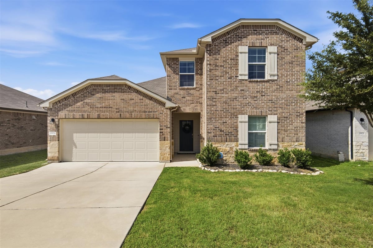 View 19924 Ann Richards Ave in Carillon Residential Community 19924 Ann Richards Ave - front exterior - Luxury home in Carillon Residential Community, Manor, TX