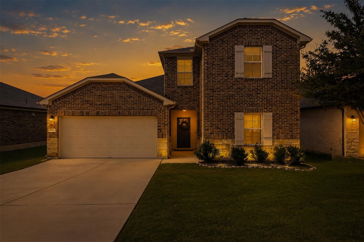 View 19924 Ann Richards Ave in Carillon Residential Community 19924 Ann Richards Ave - front exterior - Luxury home in Carillon Residential Community, Manor, TX