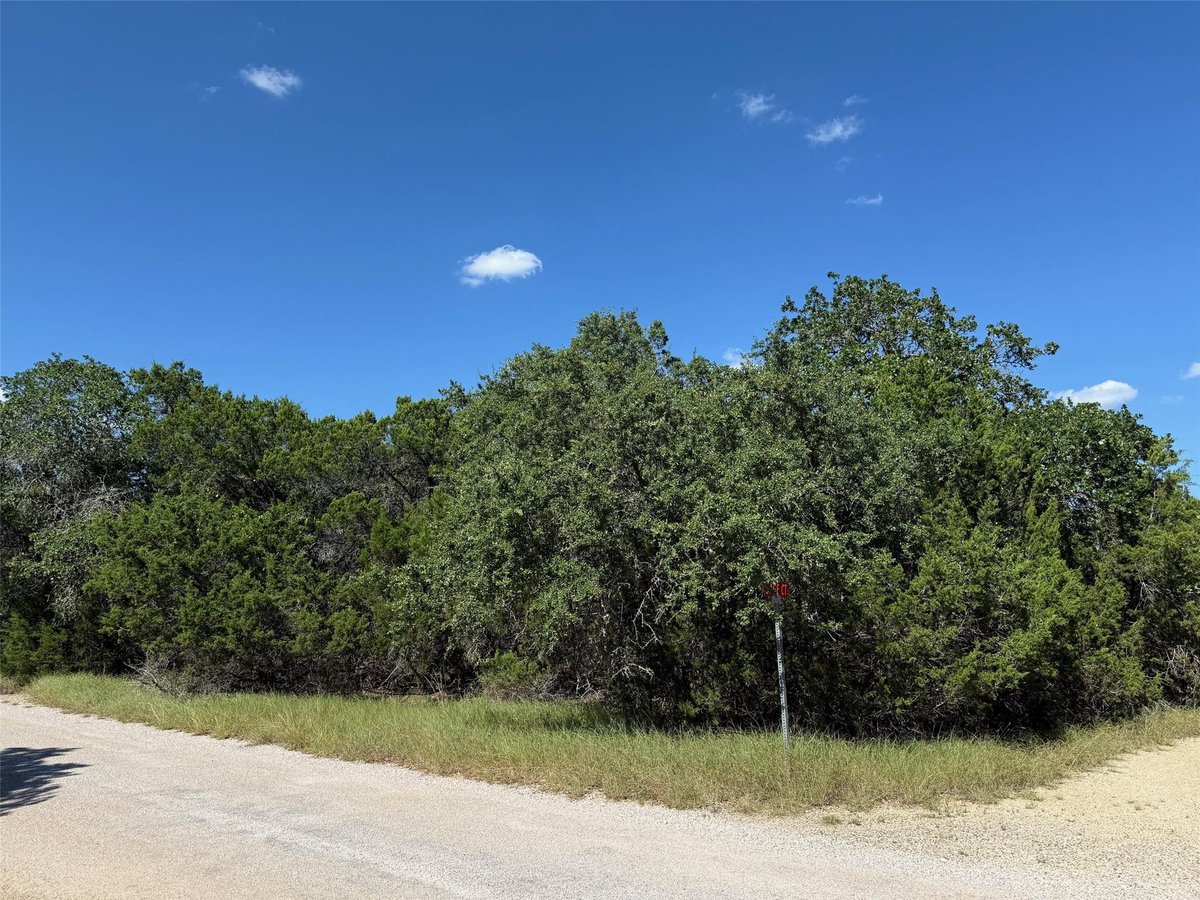 View 2 Sage Ct in Woodcreek Sec 8 2 Sage Ct - front exterior - Luxury lot in Woodcreek Sec 8, Wimberley, TX