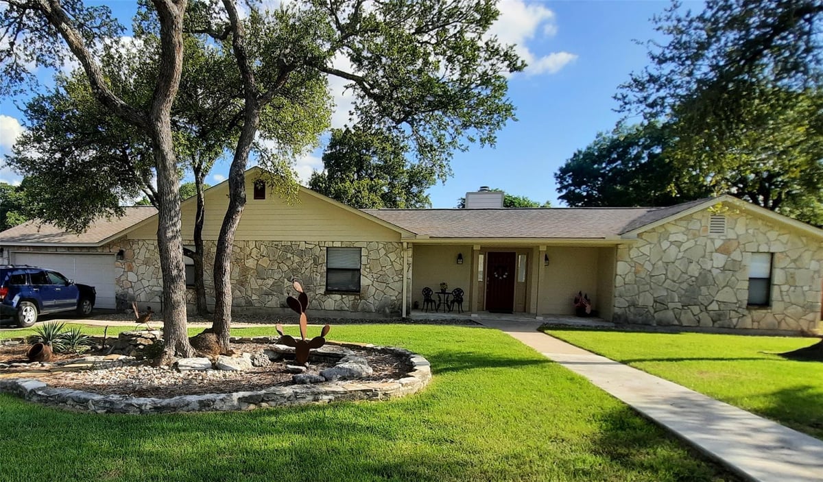 View 20 Saddle Rock RDG in Woodcreek Sec 21 20 Saddle Rock RDG - front exterior - Luxury home in Woodcreek Sec 21, Wimberley, TX