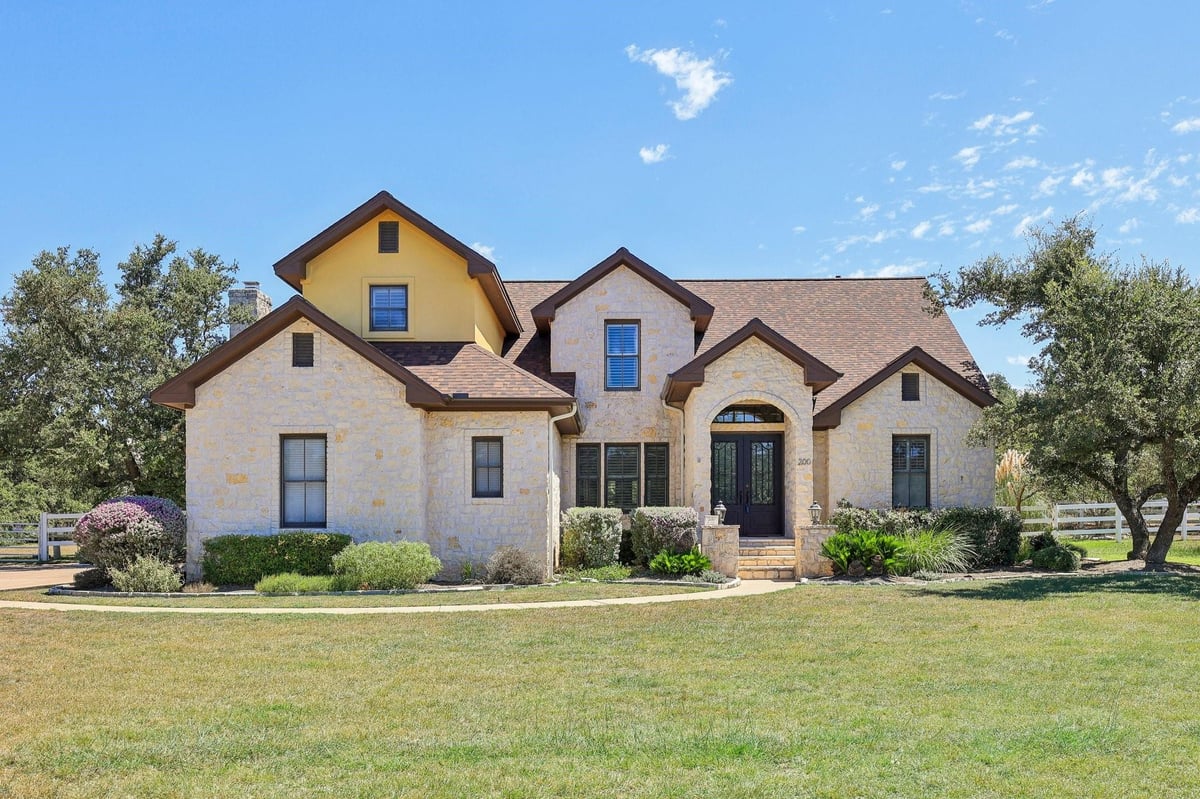 View 200 Secretariat Dr in The Polo Club At Rooster Spgs Ph 1 200 Secretariat Dr - front exterior - Luxury home in The Polo Club At Rooster Spgs Ph 1, Austin, TX