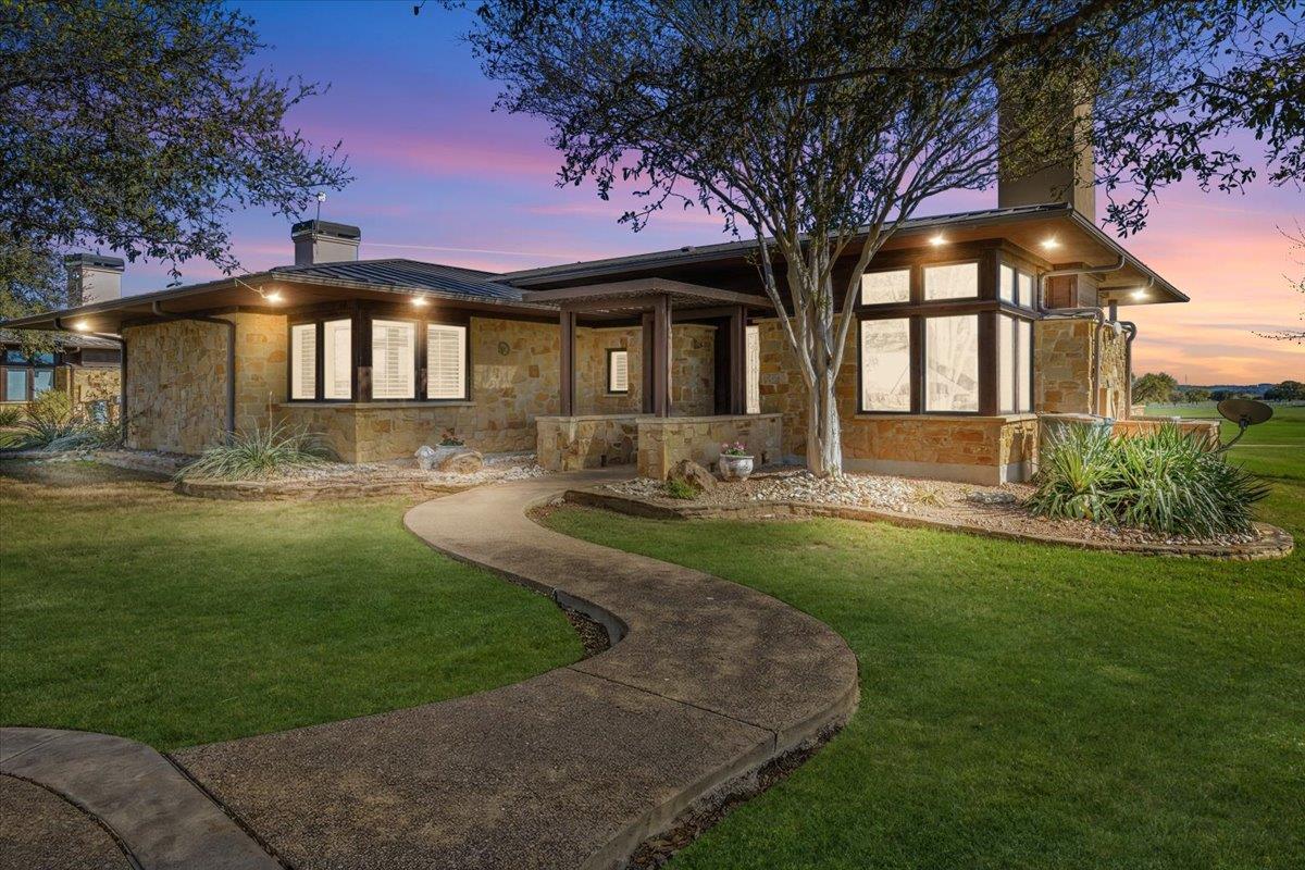 View 2001 Kahala Sunset Dr in Lakecliff On Lake Travis Sec 1 2001 Kahala Sunset Dr - front exterior - Luxury home in Lakecliff On Lake Travis Sec 1, Spicewood, TX