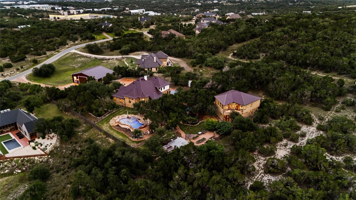 View 201 N Canyonwood Dr in Sunset Canyon Sec V 201 N Canyonwood Dr - property photo 1 - Luxury home in Sunset Canyon Sec V, Dripping Springs, TX