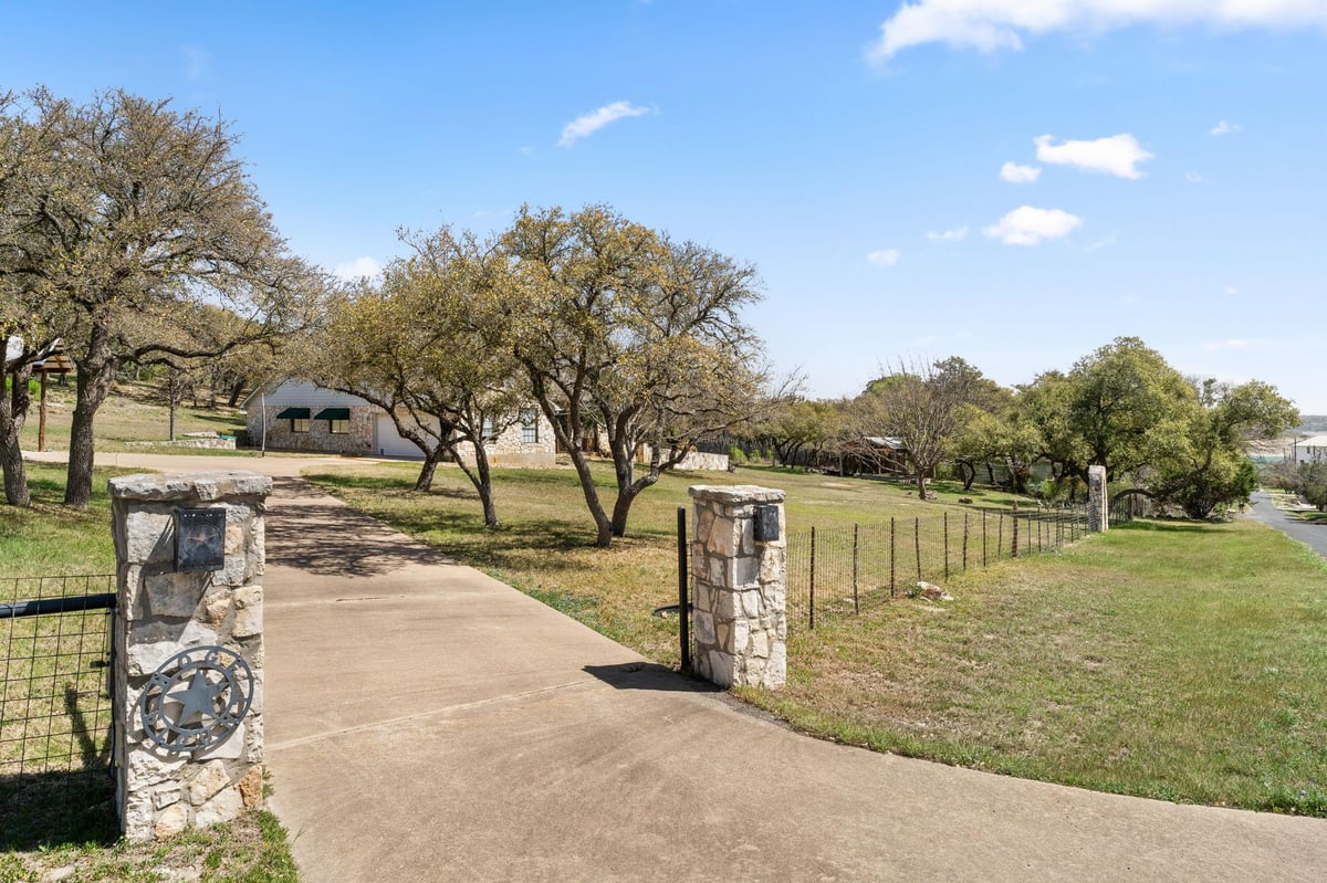 View 20106 Moon Dance Ln in Siesta Shores Sec 02 20106 Moon Dance Ln - property photo 1 - Luxury home in Siesta Shores Sec 02, Spicewood, TX