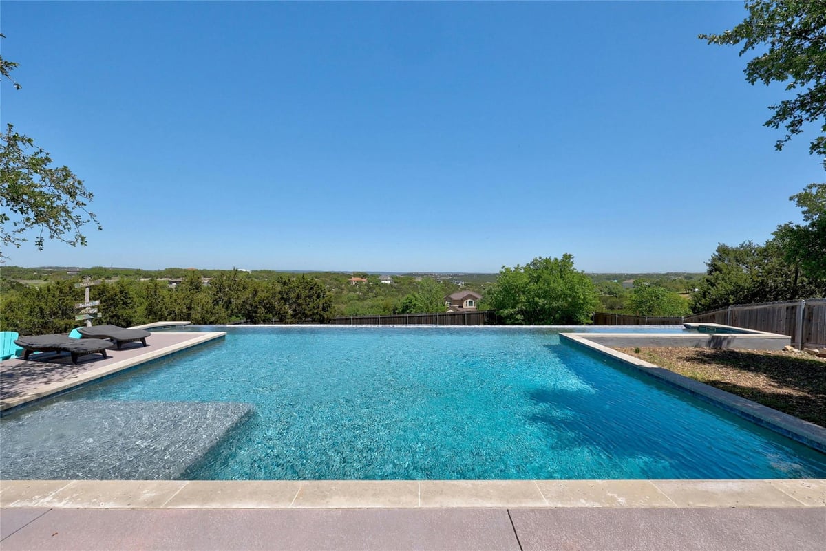 View 20117 HAYSTACK Cv in Travis Settlement Sec 03 20117 HAYSTACK Cv - front exterior - Luxury home in Travis Settlement Sec 03, Spicewood, TX