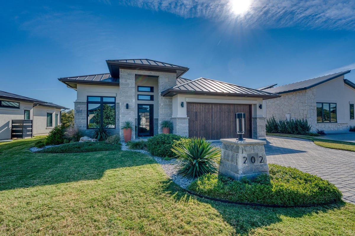 View 202 Azalea LOOP in The Reserve At Summit Rock 202 Azalea LOOP - front exterior - Luxury home in The Reserve At Summit Rock, Horseshoe Bay, TX