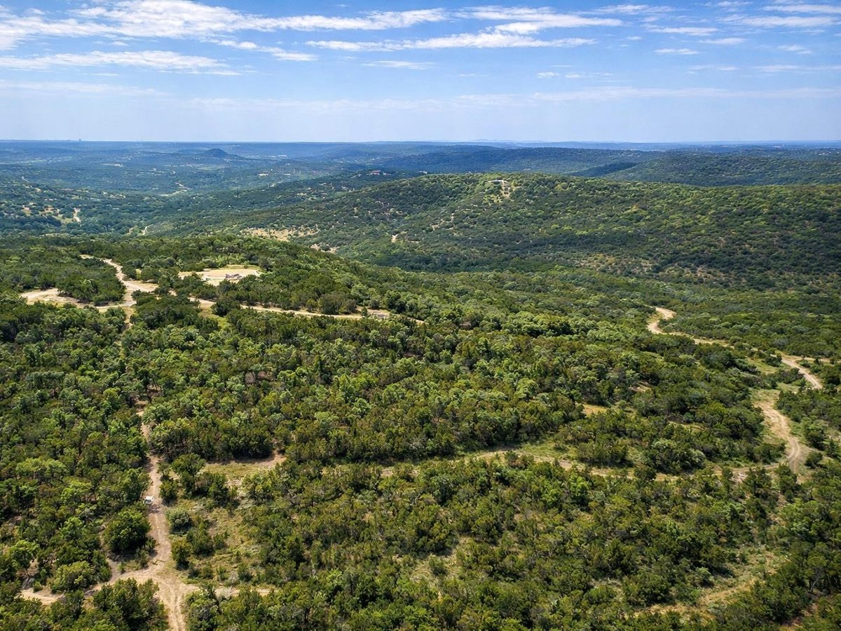 View 20220 Doe Run in Panoramic Hills 20220 Doe Run - front exterior - Luxury home in Panoramic Hills, Lago Vista, TX