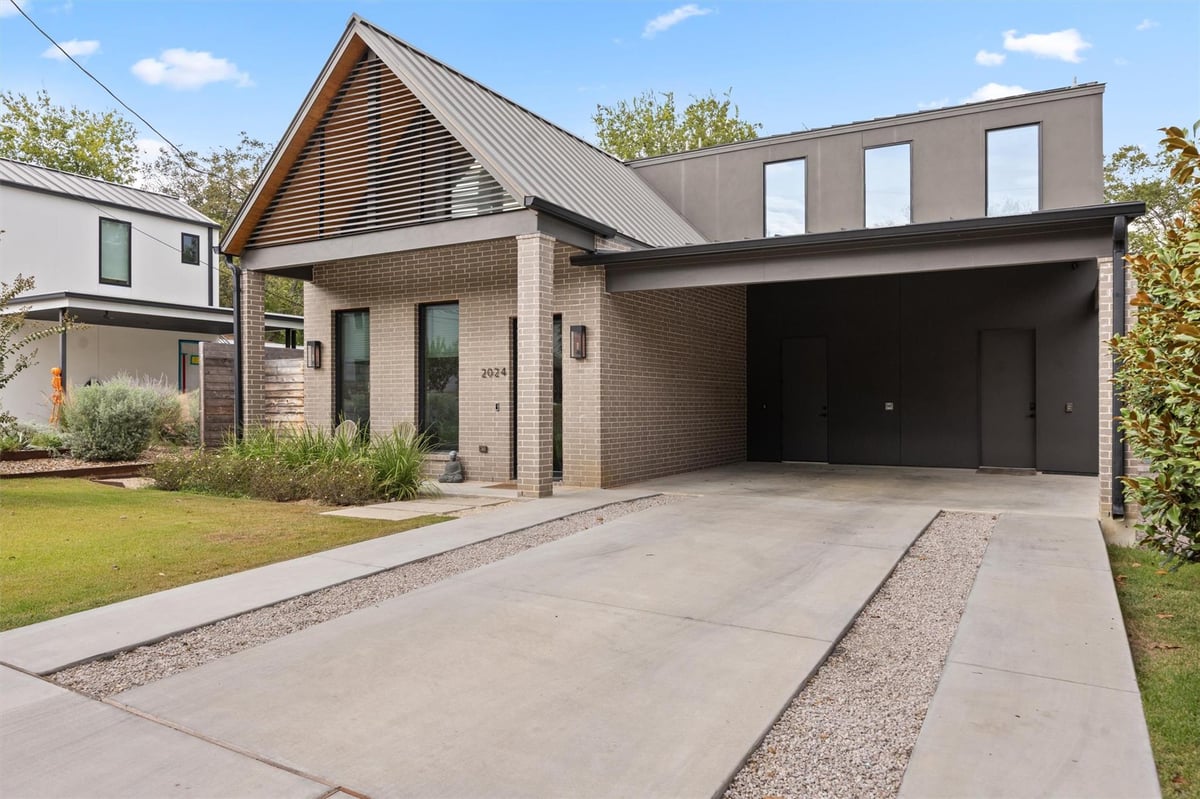 View 2024 Ford St in Sun Terrace 2024 Ford St - front exterior with modern carport design - Luxury home in Sun Terrace, Austin, TX