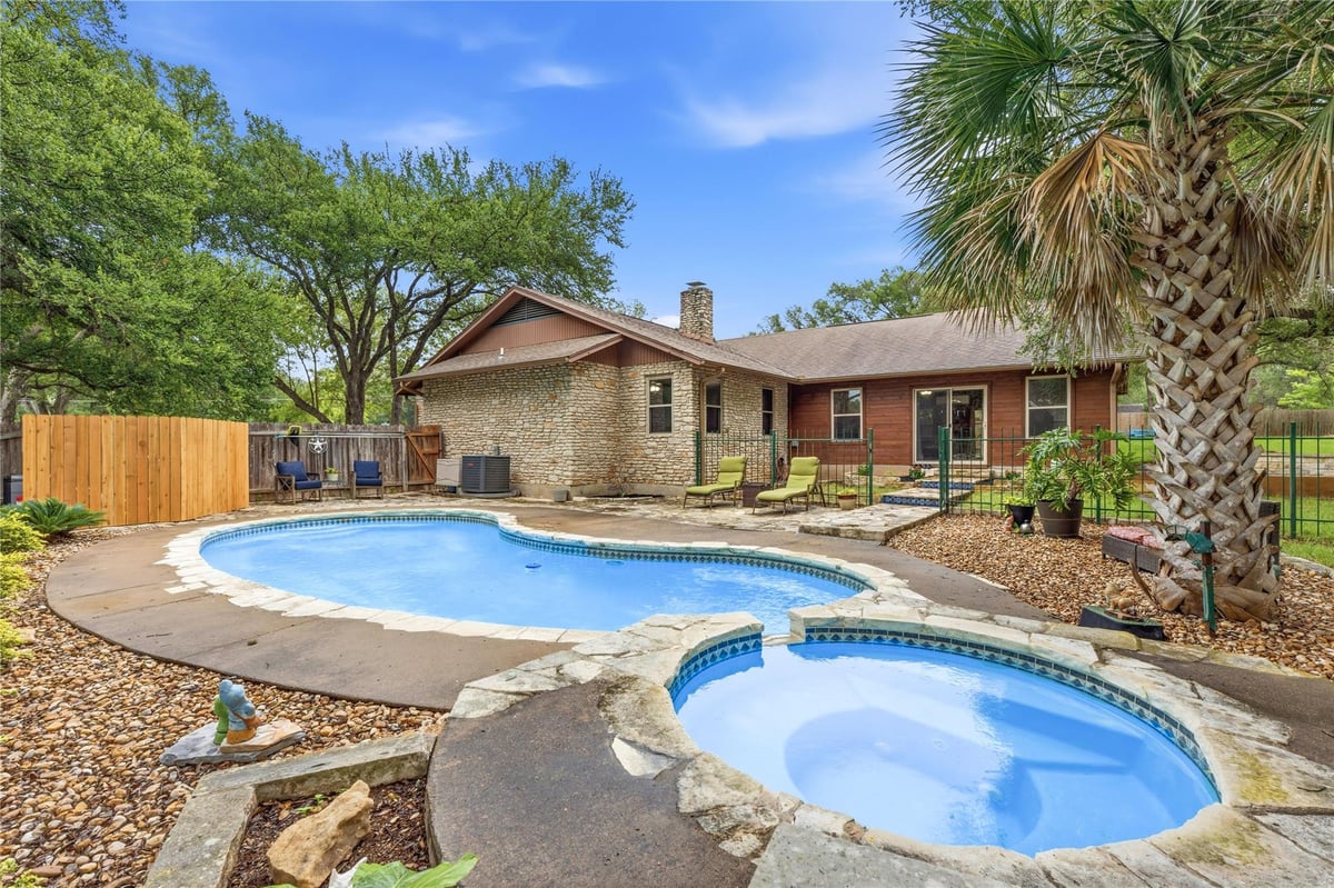 View 203 Leisurewoods Dr in Leisurewoods Sec 1 203 Leisurewoods Dr - front exterior - Luxury home in Leisurewoods Sec 1, Buda, TX