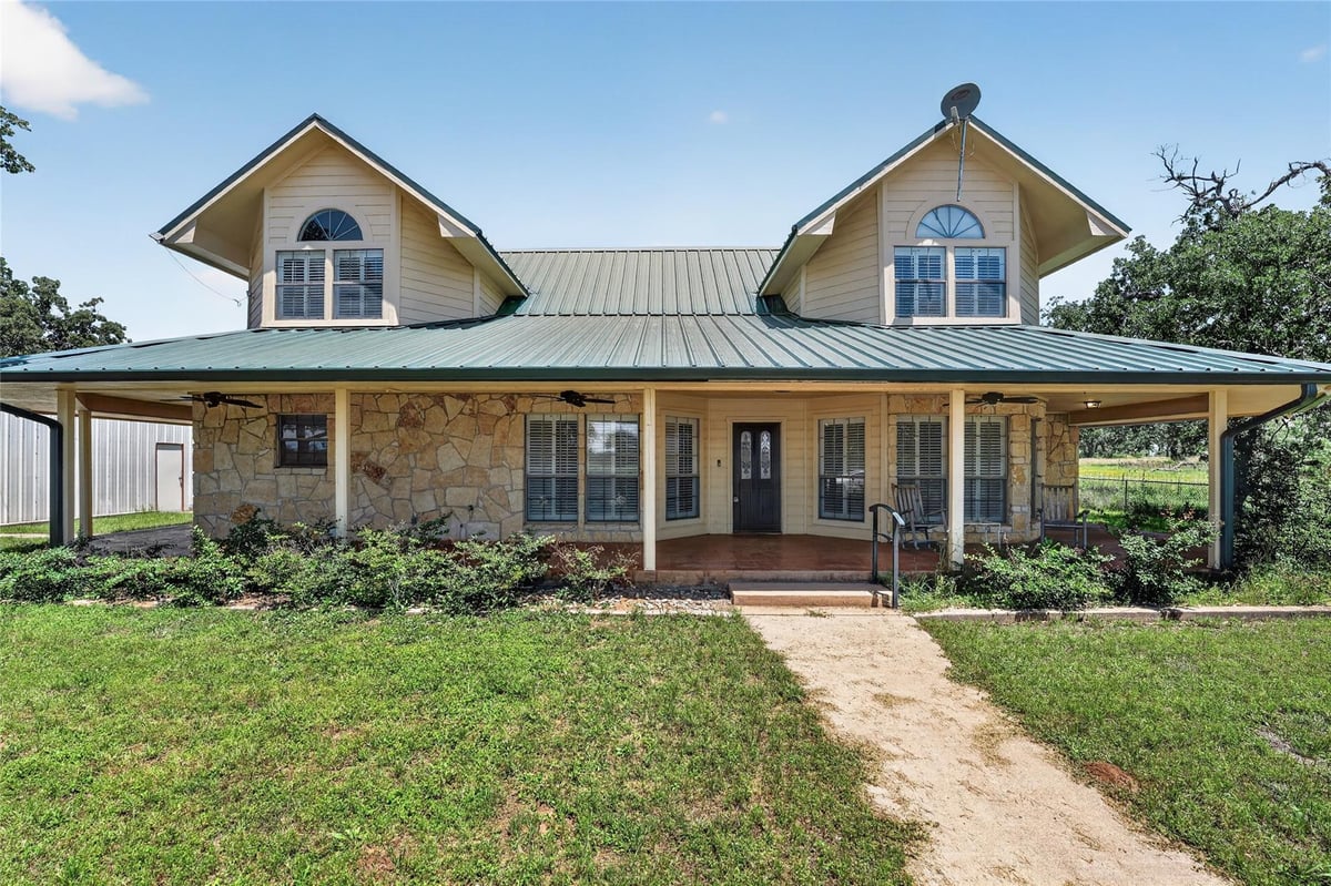 View 203 Oxbow TRL in Oxbow Estates 203 Oxbow TRL - front exterior - Luxury home in Oxbow Estates, Marble Falls, TX