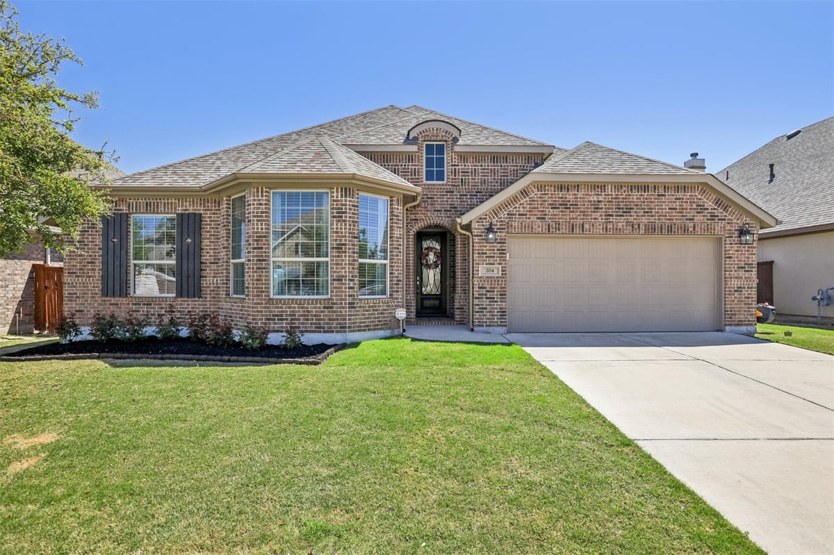View 204 Miracle Rose Way in Santa Rita Ranch Ph 1 Sec 3B 204 Miracle Rose Way - front exterior - Luxury home in Santa Rita Ranch Ph 1 Sec 3B, Liberty Hill, TX