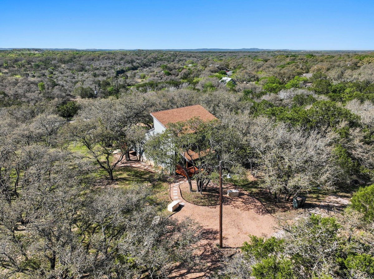 View 205 Shadows Dr in Lakeside Beach 205 Shadows Dr - front exterior - Luxury home in Lakeside Beach, Spicewood, TX
