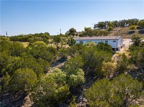 Primary bedroom at 2051 Lost Valley Rd - Longview Add, Dripping Springs, TX