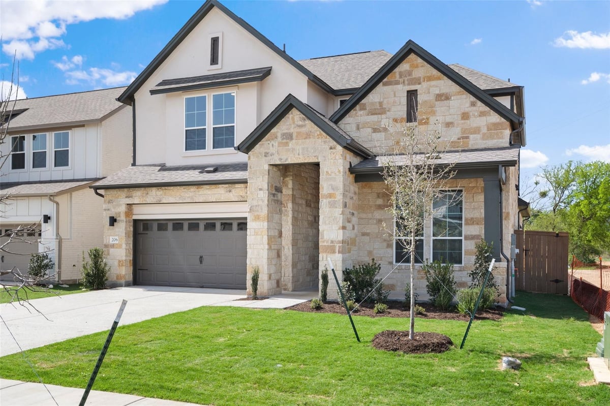 View 206 San Saba Dr in Persimmon 206 San Saba Dr - front exterior - Luxury home in Persimmon, Buda, TX