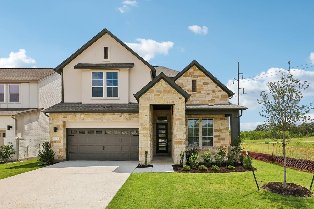View 206 San Saba DR in Persimmon 206 San Saba DR - front exterior - Luxury home in Persimmon, Buda, TX