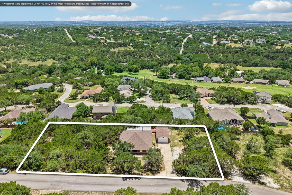 View 20609 Bridal Path RD in Lago Vista Country Club Estate 20609 Bridal Path RD - front exterior - Luxury home in Lago Vista Country Club Estate, Lago Vista, TX