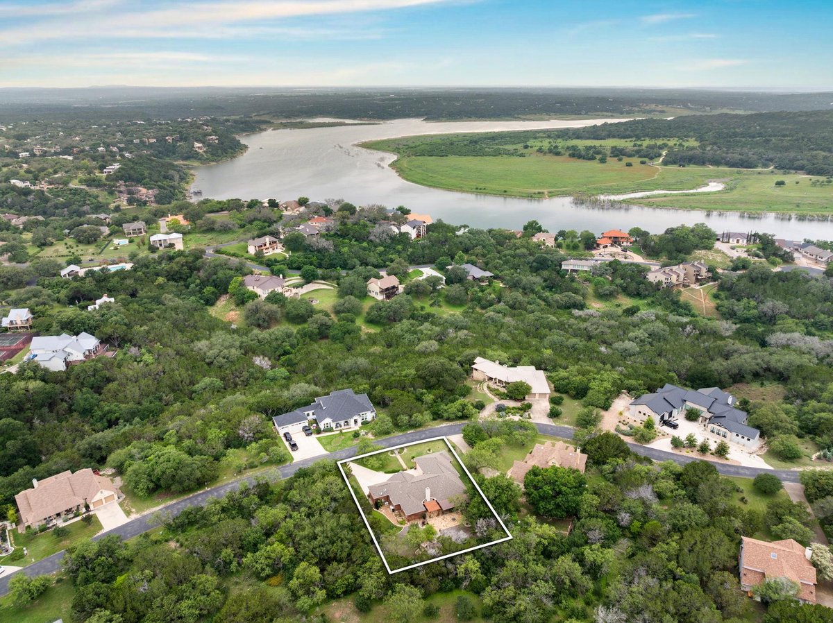 View 207 Cove Creek DR in Ridge Harbor 207 Cove Creek DR - front exterior - Luxury home in Ridge Harbor, Spicewood, TX