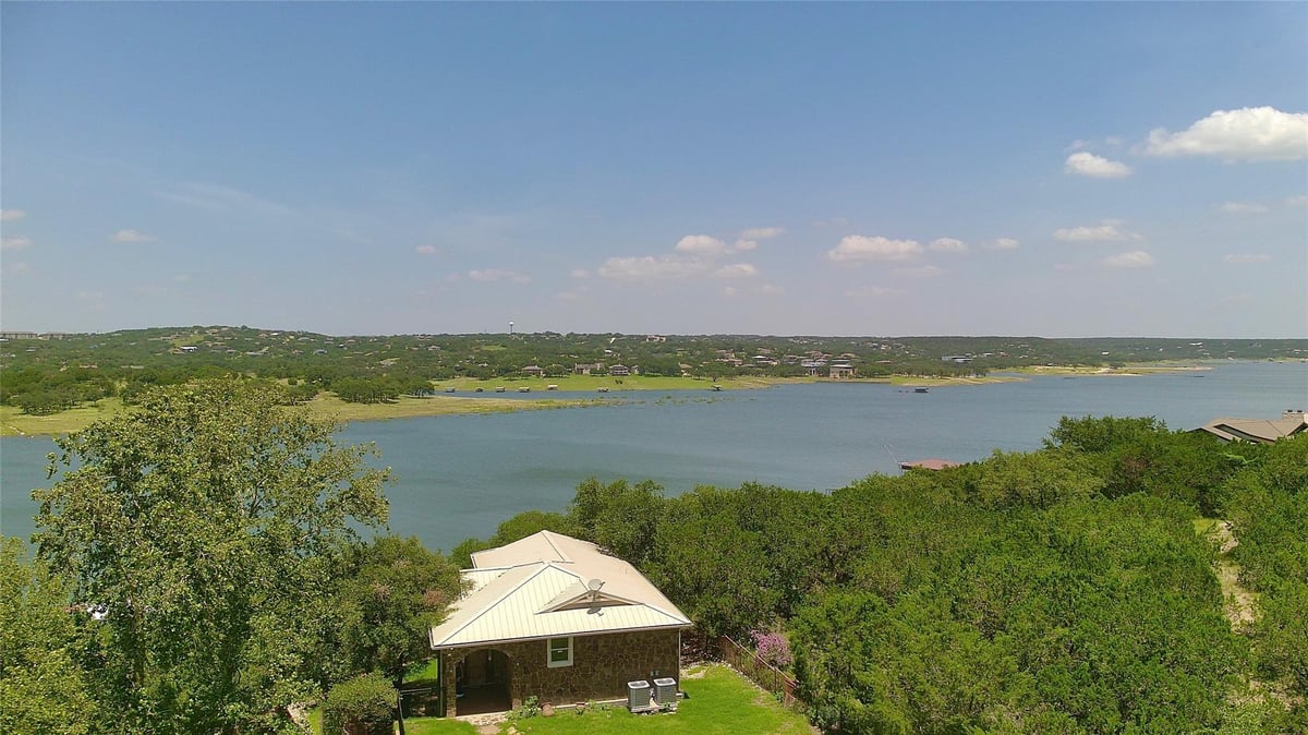View 20700 E Lakeshore Dr in Cat Eddy 20700 E Lakeshore Dr - front exterior - Luxury home in Cat Eddy, Spicewood, TX