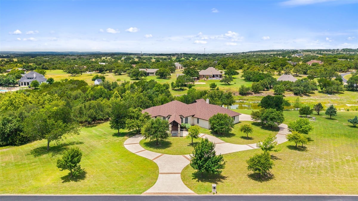 View 208 Hacienda PL in Dos Lagos Sub 208 Hacienda PL - front exterior - Luxury home in Dos Lagos Sub, Dripping Springs, TX