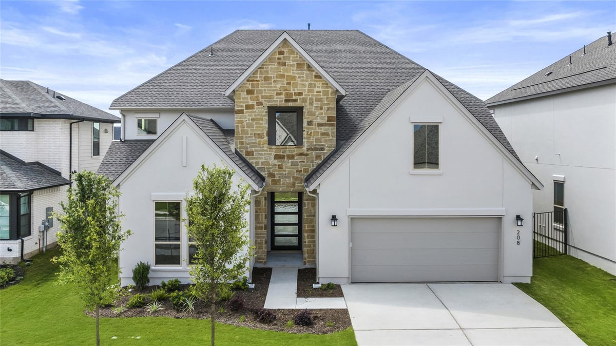 View 208 Maton Way in Santa Rita Ranch - Eldorado - Sierra Collection 208 Maton Way - front exterior - Luxury home in Santa Rita Ranch - Eldorado - Sierra Collection, Liberty Hill, TX
