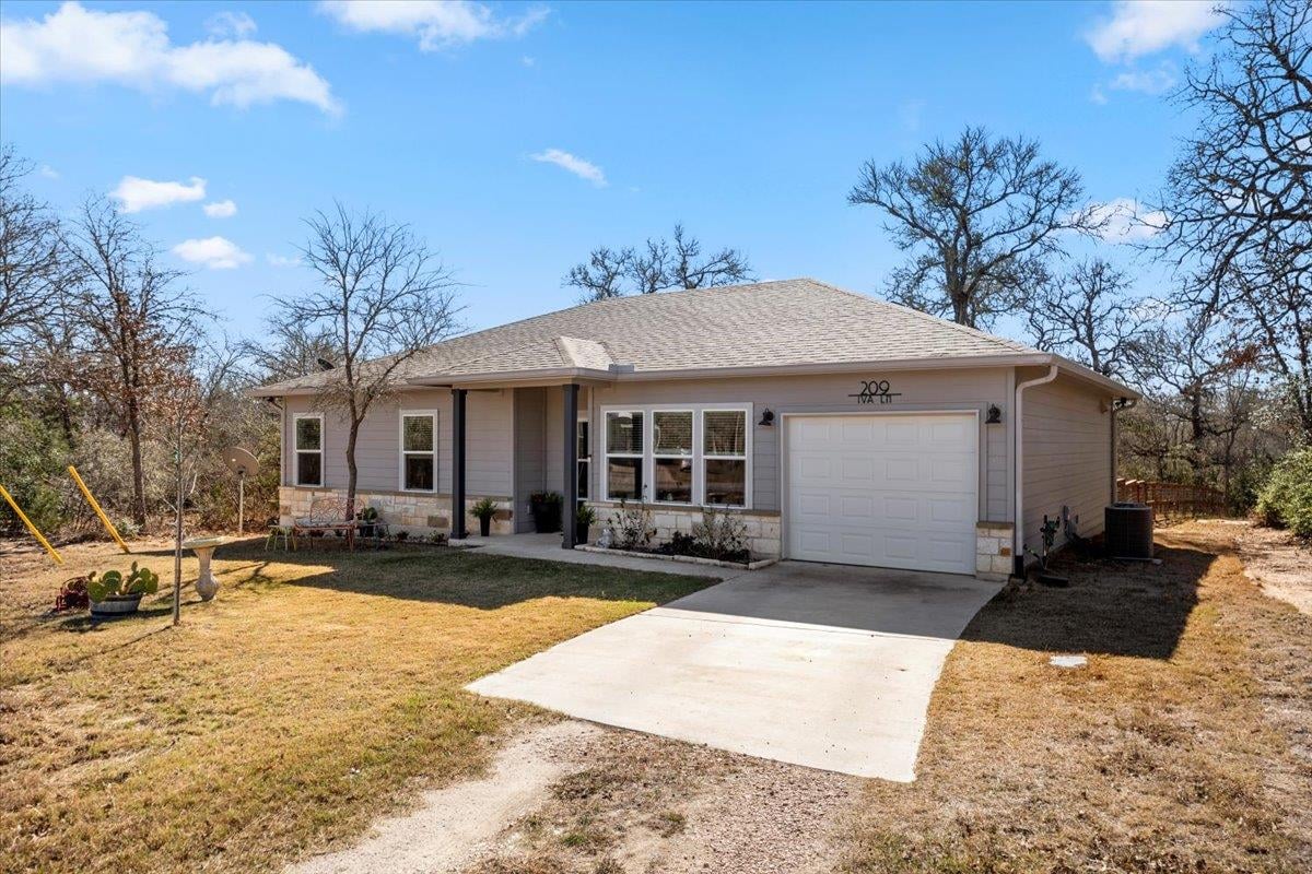 View 209 Iva Ln in Tahitian Village, 209 Iva Ln - front exterior - Luxury home in Tahitian Village,, Bastrop, TX