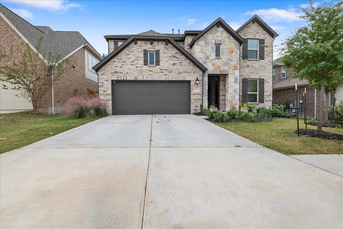 View 209 Terra Manor Trl in Parkside on the River 45s 209 Terra Manor Trl - front exterior - Luxury home in Parkside on the River 45s, Georgetown, TX