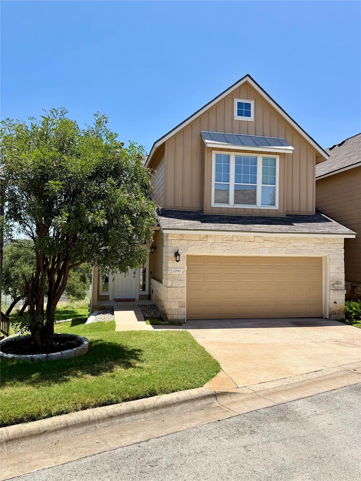 View 20911 Waterside DR Unit #9 in Waterside Oaks Condo Amd 20911 Waterside DR Unit #9 - front exterior - Luxury home in Waterside Oaks Condo Amd, Lago Vista, TX