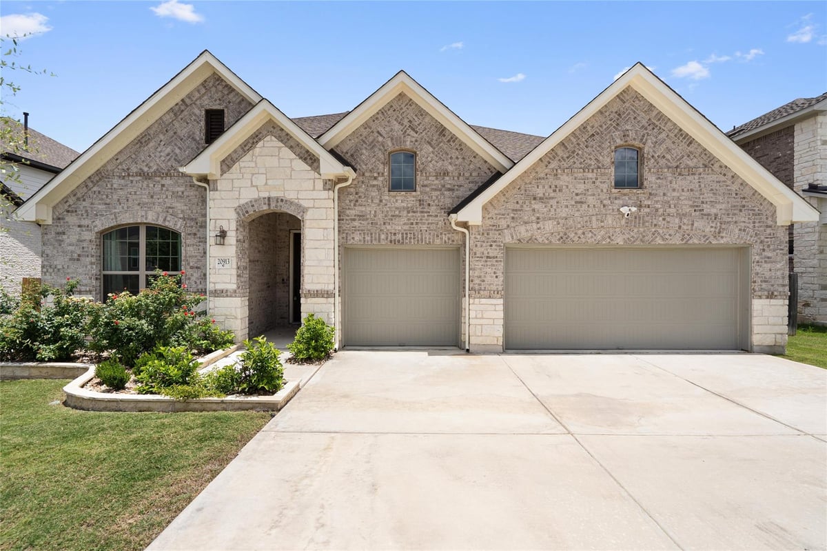 View 20913 Maggie LN in Park At Blackhawk 4 20913 Maggie LN - front exterior - Luxury home in Park At Blackhawk 4, Pflugerville, TX