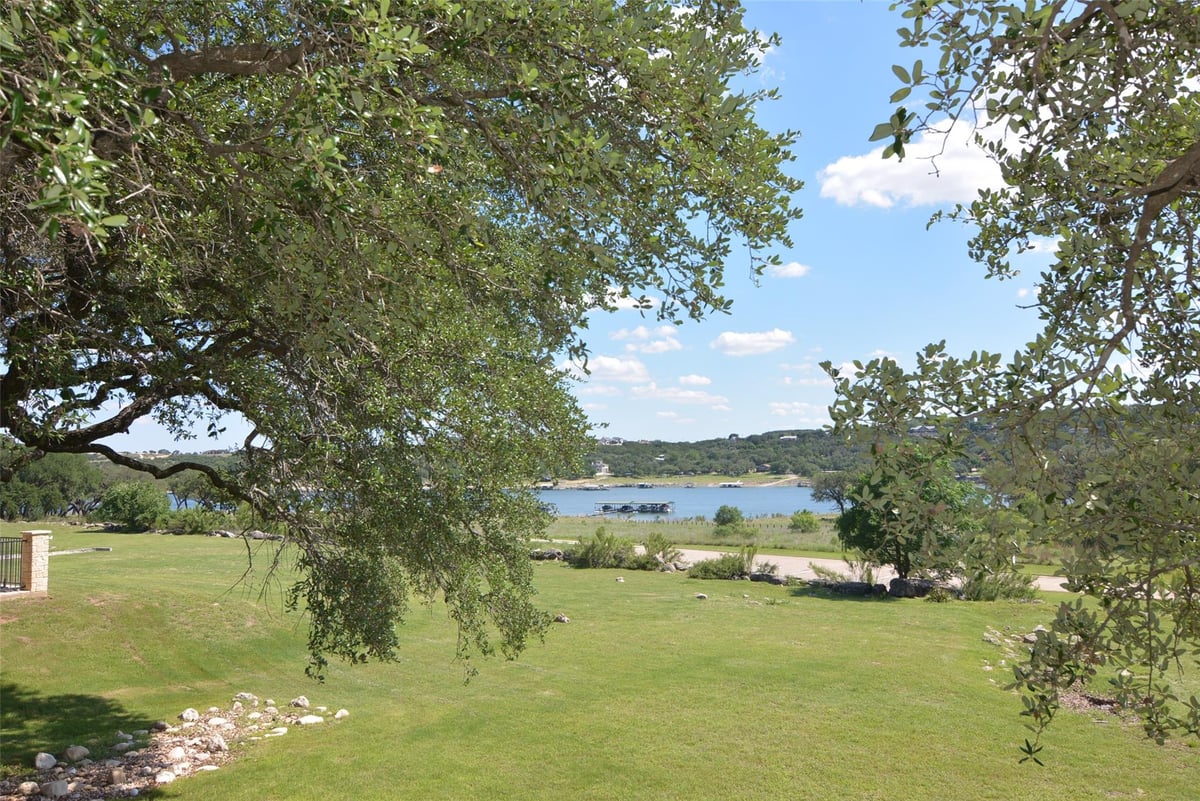 View 20975 Waterside DR Unit #35 in Waterside Oaks 20975 Waterside DR Unit #35 - front exterior - Luxury home in Waterside Oaks, Lago Vista, TX